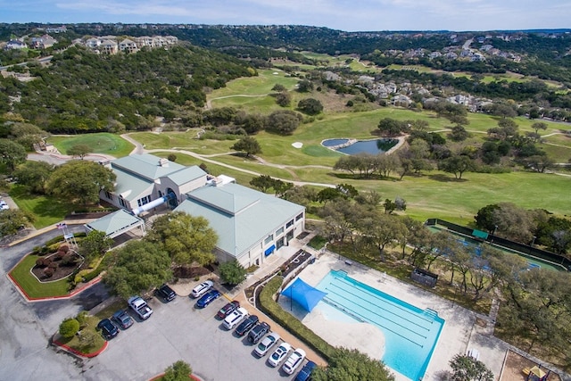 aerial view with view of golf course and a water view