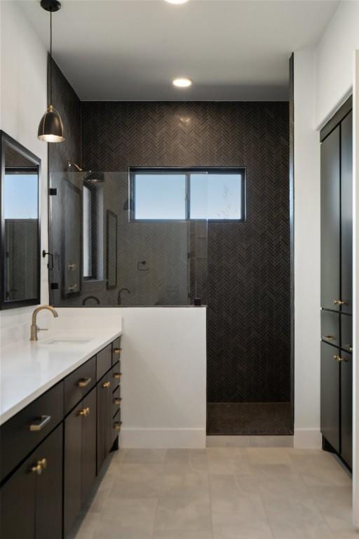 full bath featuring a wealth of natural light, vanity, and a walk in shower