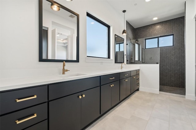 full bath featuring double vanity, walk in shower, and a sink