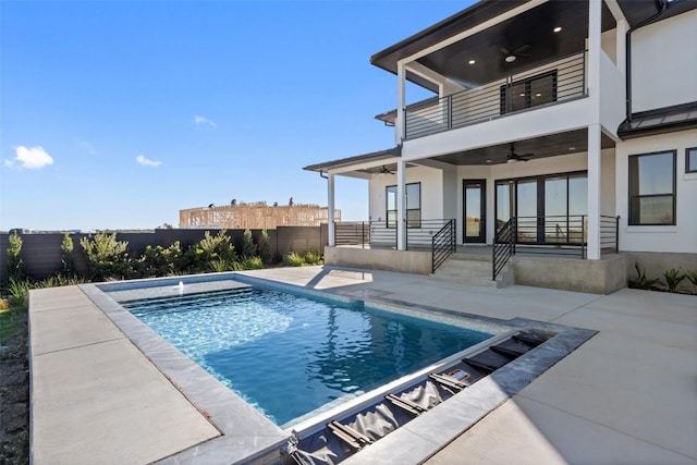 view of pool featuring ceiling fan, a patio, a fenced backyard, and a fenced in pool