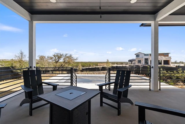 view of patio / terrace with a balcony