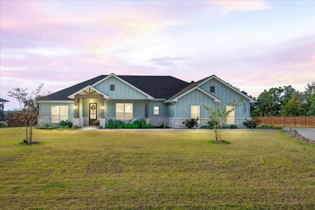 view of front of home with a lawn