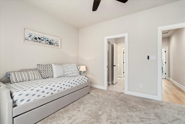 bedroom featuring light carpet and ceiling fan