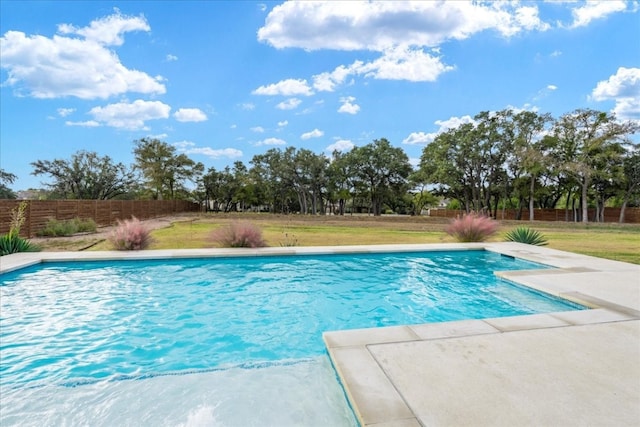 view of pool featuring a lawn