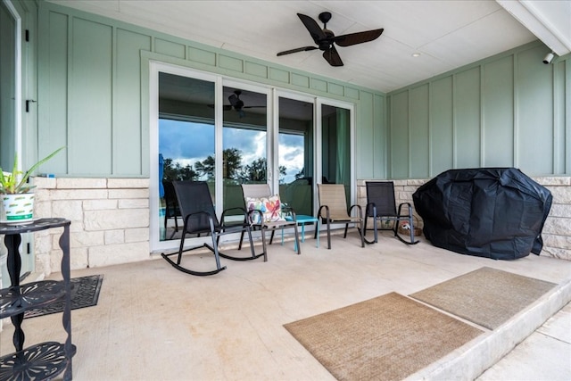 view of patio featuring area for grilling and ceiling fan