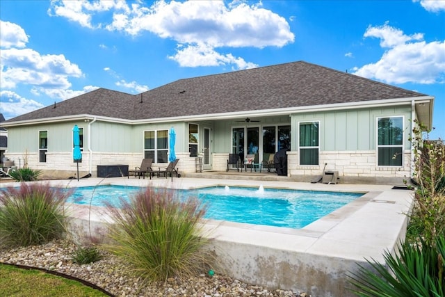 view of swimming pool with a patio and pool water feature