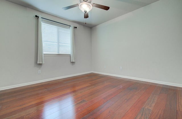 unfurnished room featuring ceiling fan and dark hardwood / wood-style flooring