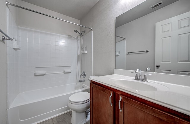 full bathroom featuring shower / bathing tub combination, a textured ceiling, toilet, vanity, and tile patterned flooring