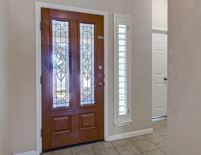 tiled foyer entrance with plenty of natural light