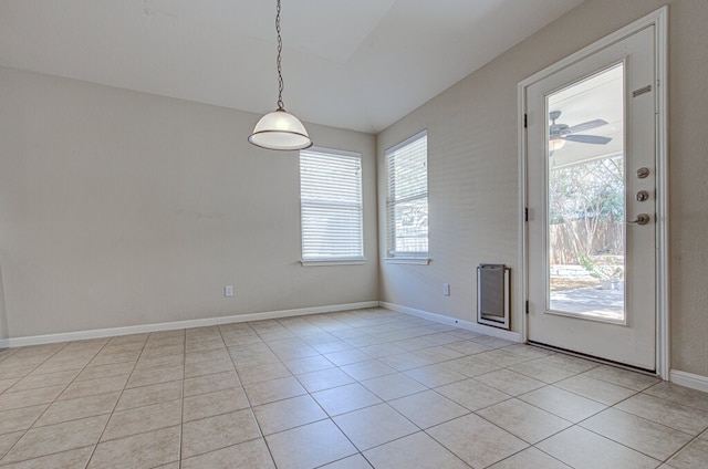 interior space featuring ceiling fan and light tile patterned floors