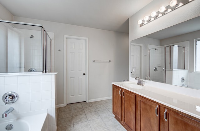 bathroom with vanity, independent shower and bath, and tile patterned flooring