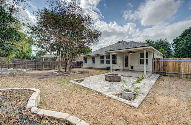 rear view of house with an outdoor fire pit, a patio area, and ceiling fan