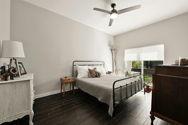 bedroom with ceiling fan and dark hardwood / wood-style flooring