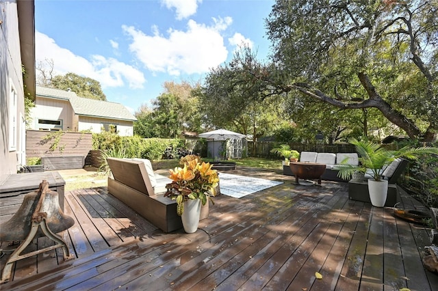 deck featuring outdoor lounge area