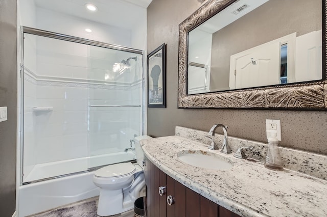 full bathroom with vanity, enclosed tub / shower combo, and toilet