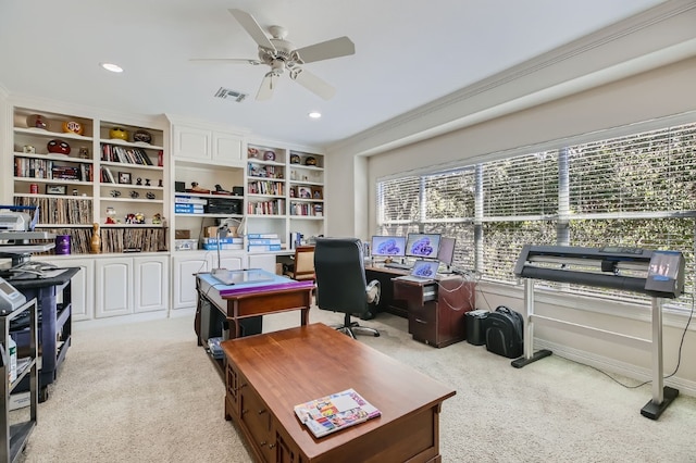 carpeted home office with ornamental molding and ceiling fan