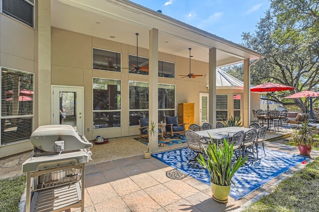 view of patio / terrace with a grill and ceiling fan