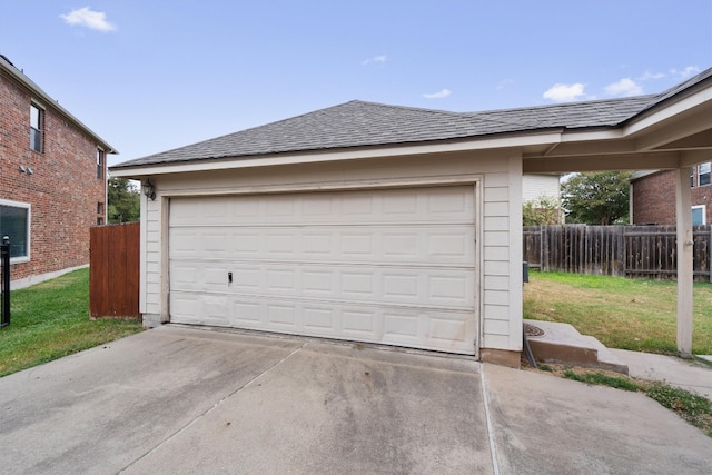 garage featuring a lawn