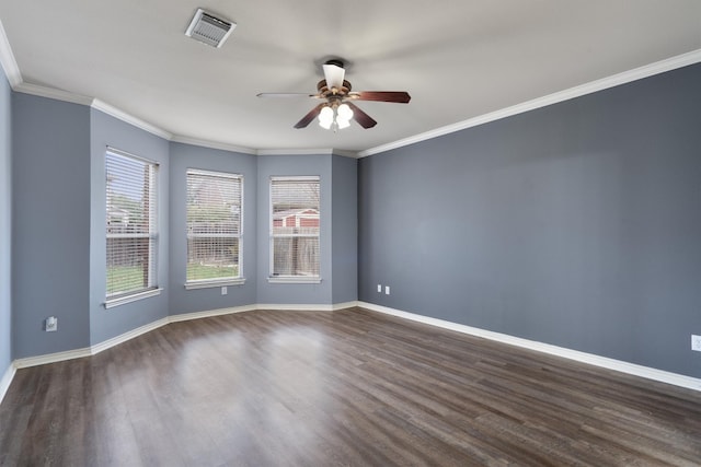 empty room featuring crown molding, ceiling fan, and dark hardwood / wood-style floors