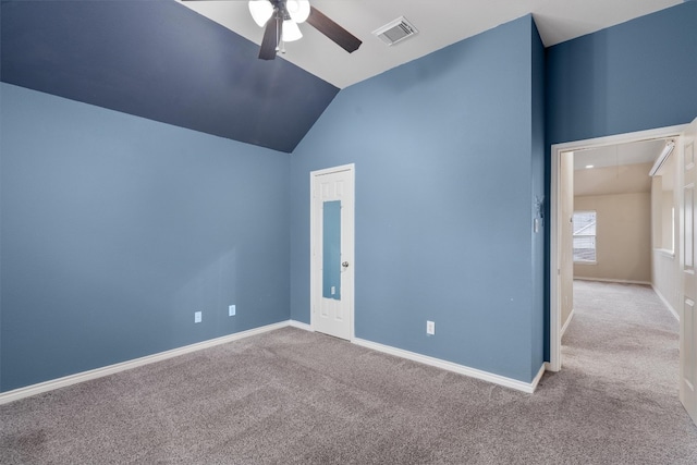 unfurnished room with lofted ceiling, light carpet, and ceiling fan