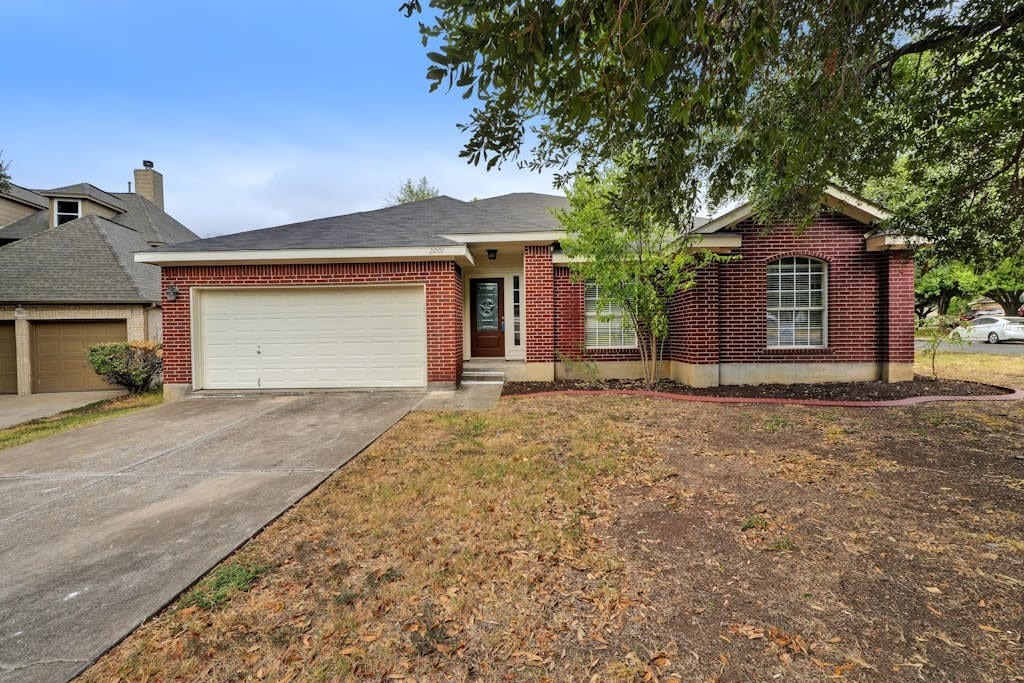 single story home with a garage