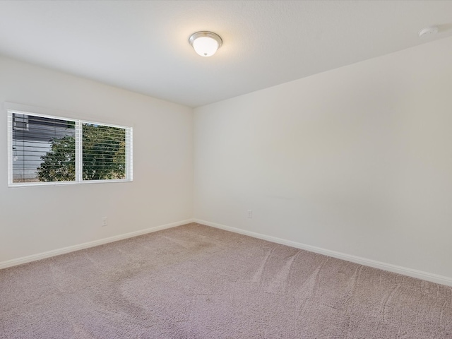 unfurnished room with carpet floors