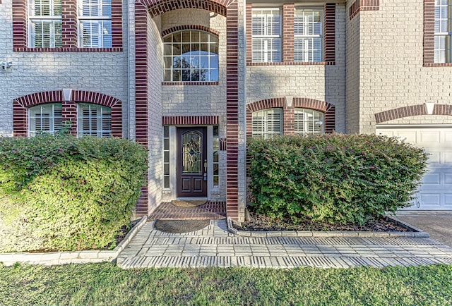 doorway to property featuring a garage