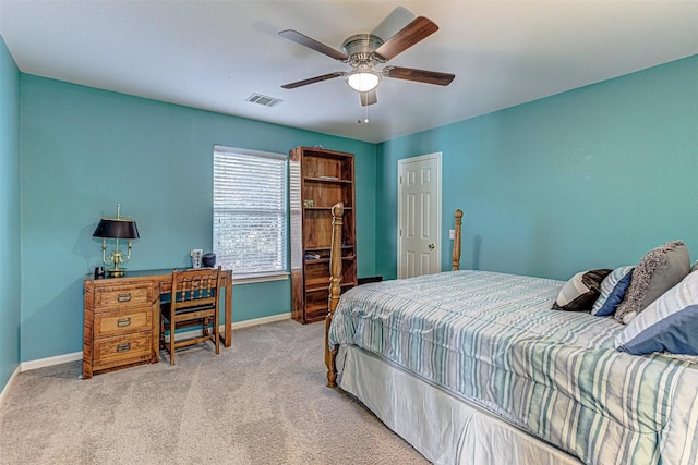 bedroom with ceiling fan, light colored carpet, visible vents, and baseboards