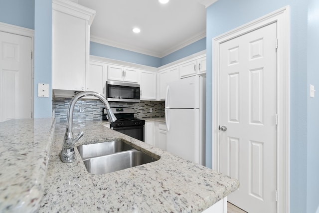 kitchen with crown molding, stainless steel appliances, light stone countertops, and white cabinets