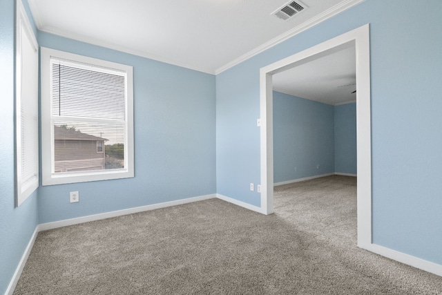 carpeted spare room with ornamental molding