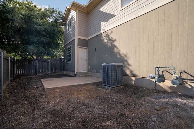 view of yard featuring a patio area and central AC