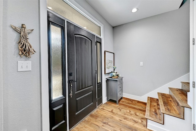 entryway with light hardwood / wood-style floors