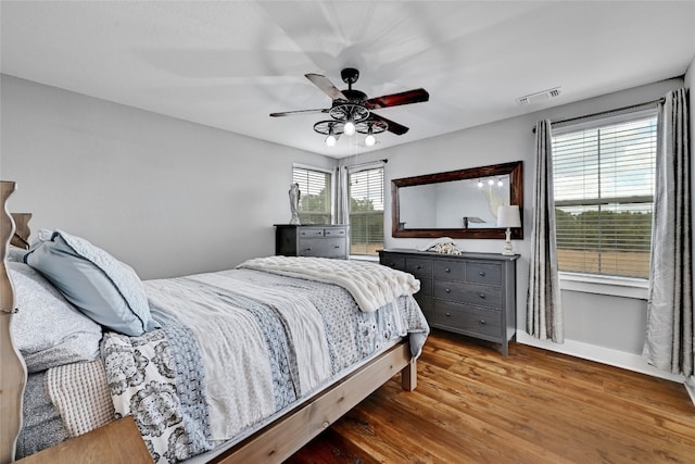 bedroom featuring hardwood / wood-style flooring and ceiling fan