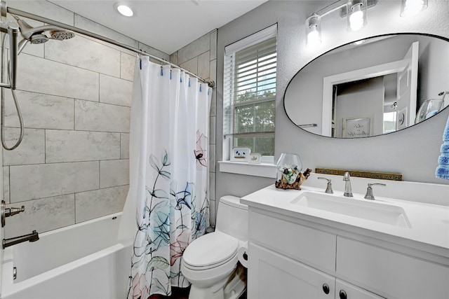 full bathroom with vanity, toilet, and shower / bath combo with shower curtain