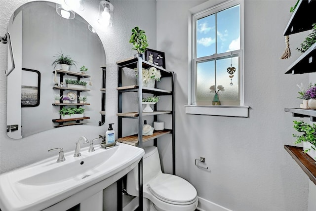 bathroom with toilet and sink