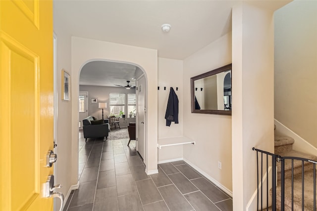 entrance foyer with ceiling fan