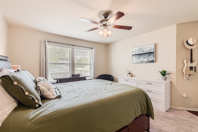 bedroom featuring light carpet and ceiling fan