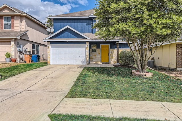 view of front of property featuring central air condition unit, a front yard, and a garage