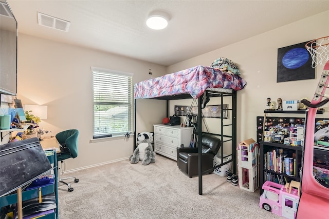 bedroom featuring light colored carpet