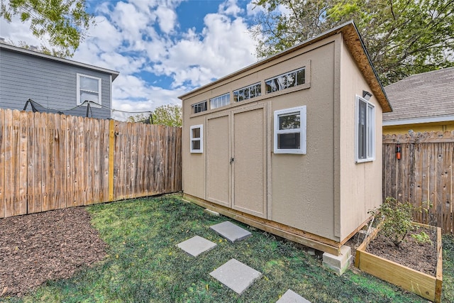 view of outdoor structure with a yard