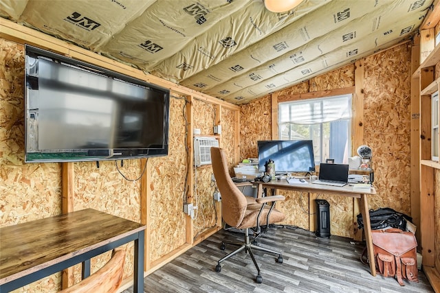 office with dark hardwood / wood-style floors and lofted ceiling