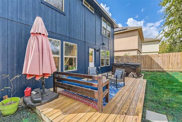 deck featuring a hot tub