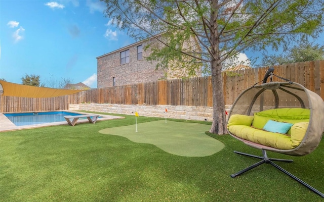 view of yard featuring a fenced in pool