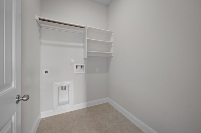 washroom featuring gas dryer hookup, electric dryer hookup, washer hookup, and light tile patterned floors