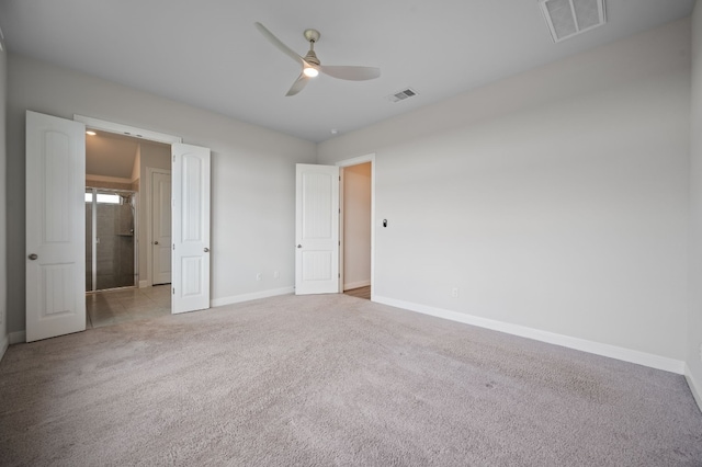 unfurnished bedroom with ceiling fan and light carpet