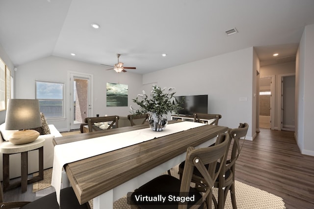 dining space featuring ceiling fan, hardwood / wood-style flooring, and lofted ceiling