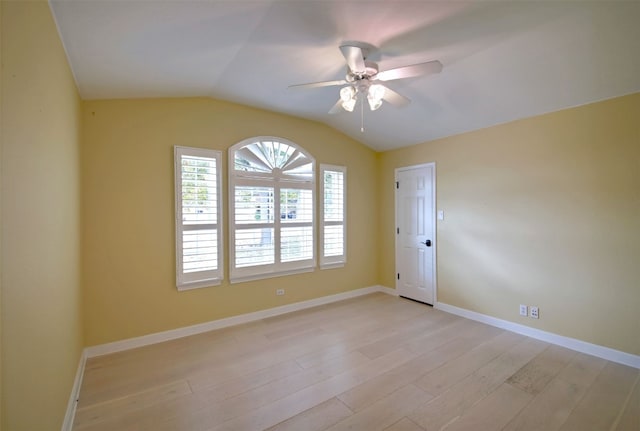 unfurnished room featuring light hardwood / wood-style flooring, ceiling fan, and lofted ceiling