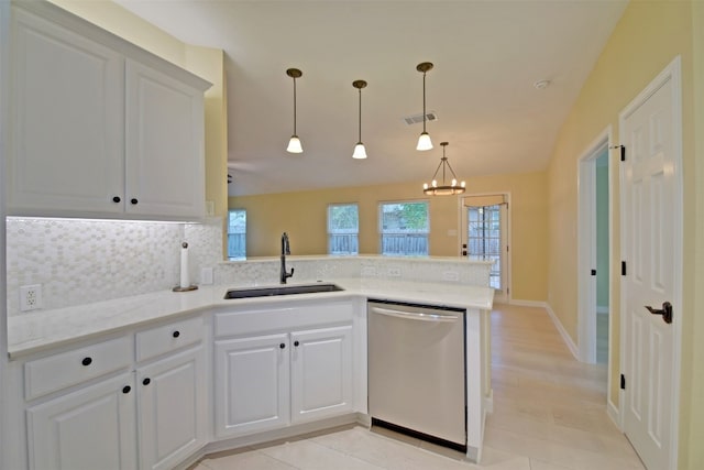 kitchen featuring dishwasher, decorative backsplash, white cabinetry, and sink