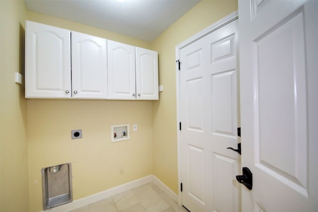 clothes washing area featuring hookup for an electric dryer, washer hookup, and cabinets