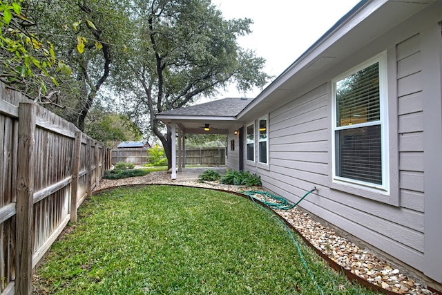 view of yard featuring ceiling fan and a patio area